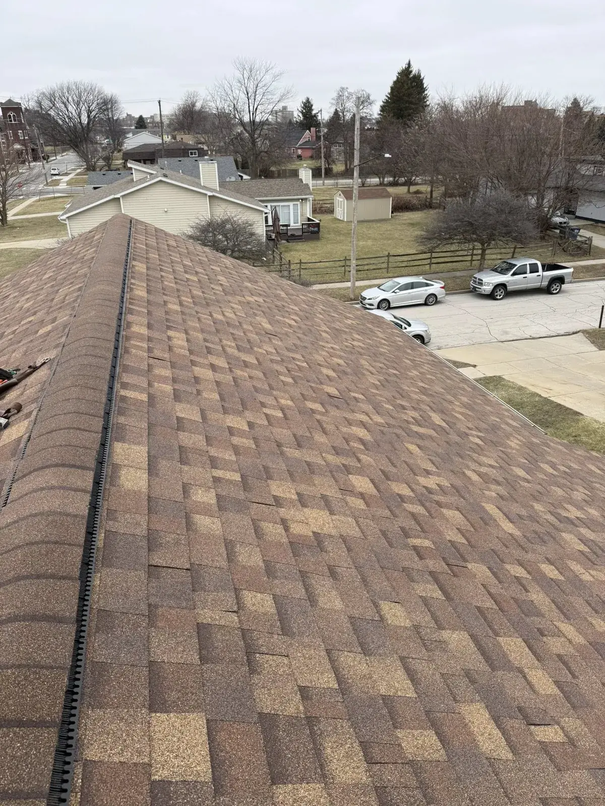 Aerial view of a home with new roof and gutter system in Northwest Ohio