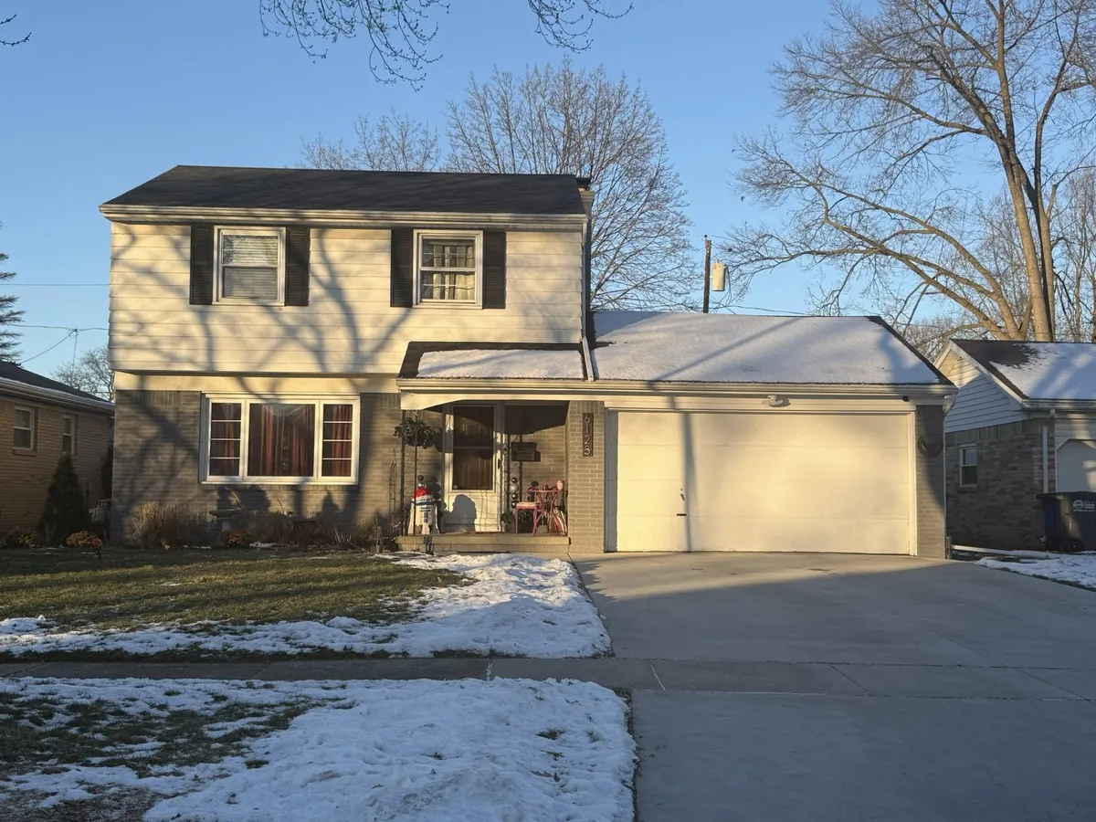 Suburban cape style home with a new roof in Archbold, Ohio after a winter install
